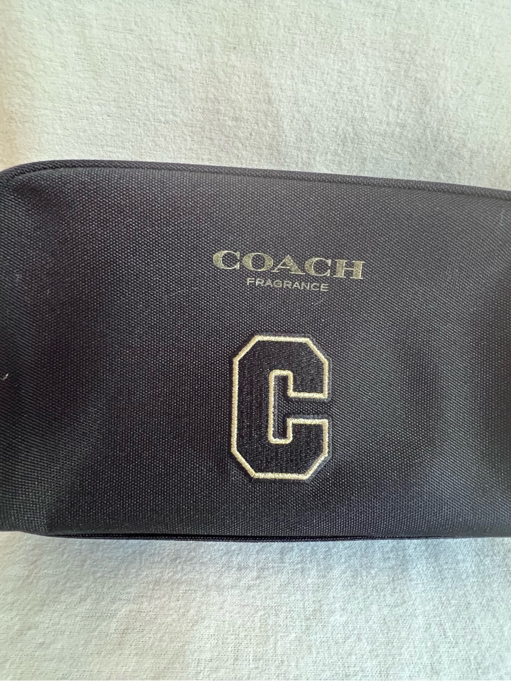 Coach Black Toiletry Pouch with Gold Fragrance Logo and Embroidered C